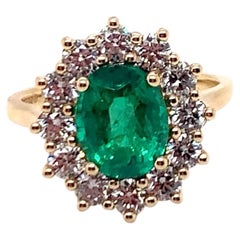 2.07 Carat Oval Shaped Emerald Cluster Ring with 12 Diamonds in 18K Yellow Gold