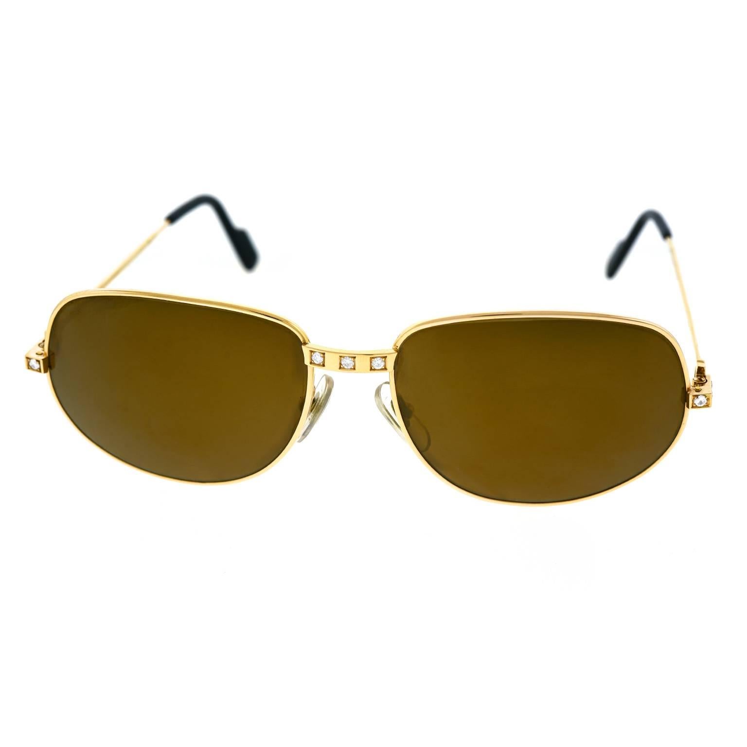Circa 2000s, 18k, Cartier, France.  Part of the Santos style set, this sumptuous pair of diamond-set 18k gold sunglasses from Cartier are radiantly chic. The renowned jeweler and iconic luxury brand offers narrative life possibilities defined by the