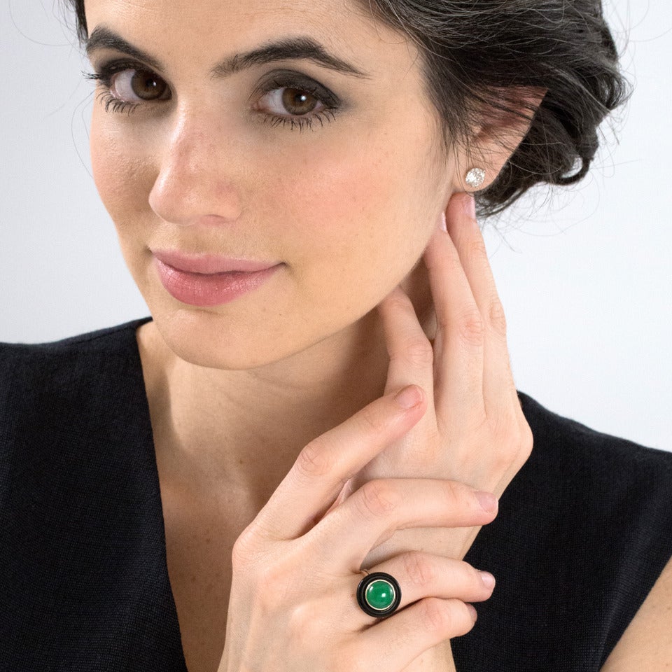 Circa 1920s-40s, 14k, American.  Concentric bands of black, gold and green define the Art Deco nature of this visually engaging ring. Its look is stylishly modern, boldly illustrating the American penchant for fashionable jewelry. Meticulous