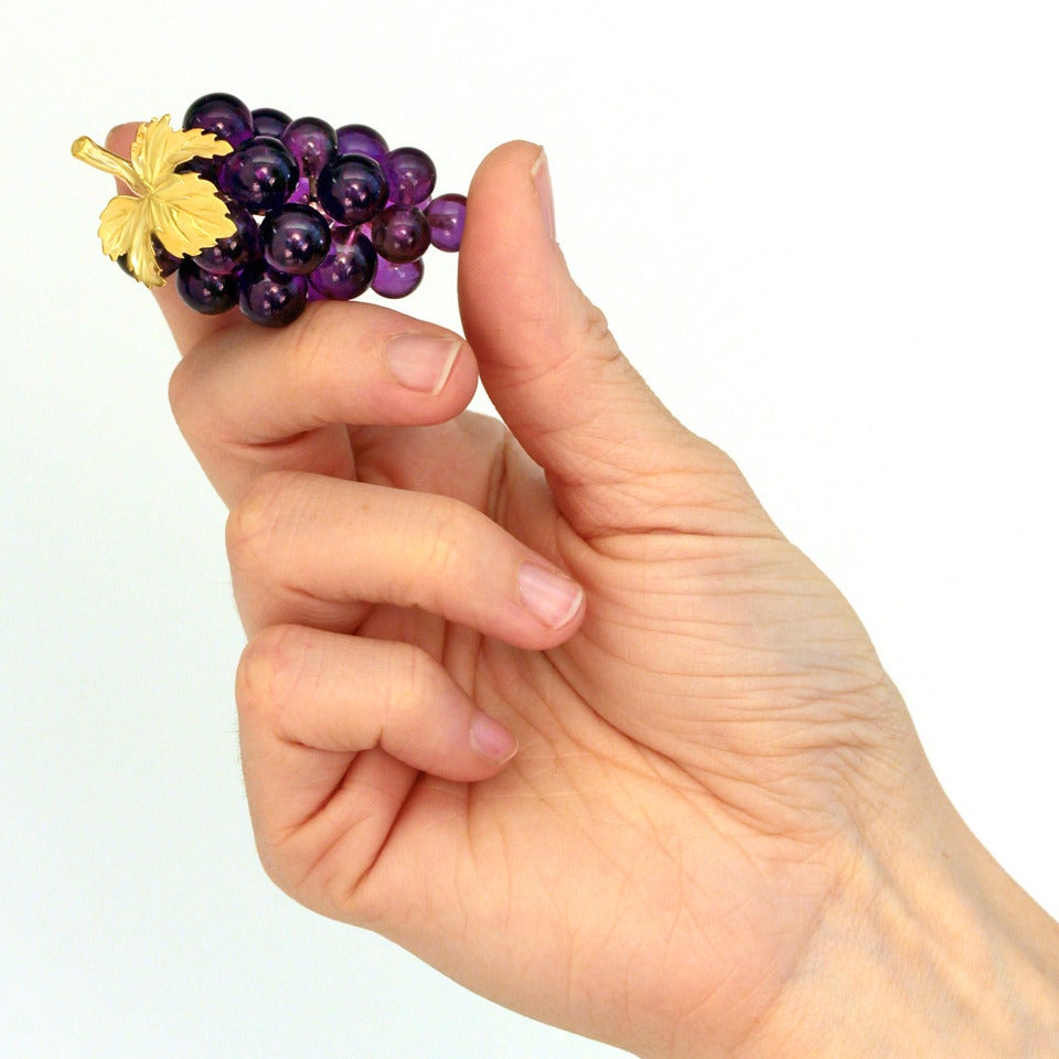 Circa 1960s, 18k, Vacheron, Switzerland.  Famous for superlative watches, Vacheron Constantine also makes incredible jewelry and amazing objet d’art. This enchanting bunch of Amethyst grapes is one of a pair (see #17472). They could be table