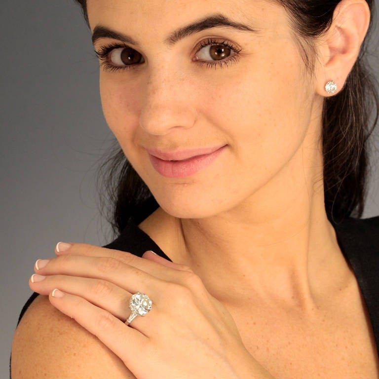 Circa 1950s, platinum, American.  This classic platinum fifties ring is set with a brilliant 9.25 carat diamond accented by two .50 carat diamond baguettes. The look is big, chunky and all about the diamond. The main stone is accompanied by a GIA