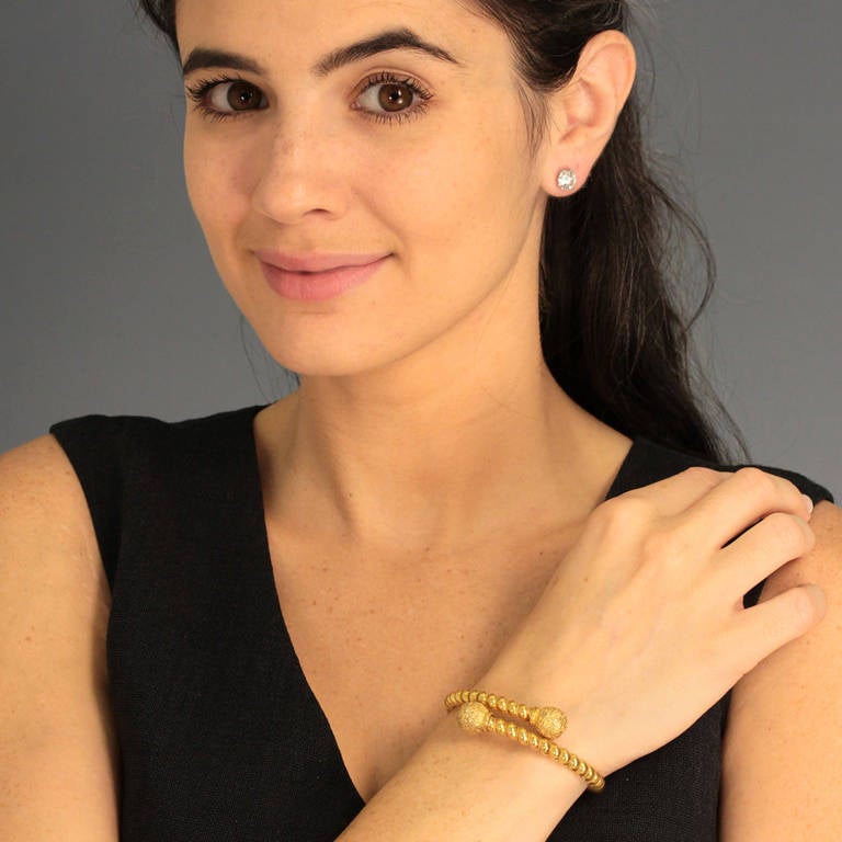 Circa 1890s, 14k, American. This very wearable Victorian bangle celebrates America's love affair with the Etruscan revival. Designers in the United States created a unique style in the Etruscan taste. These wonderful pieces are less explicit than