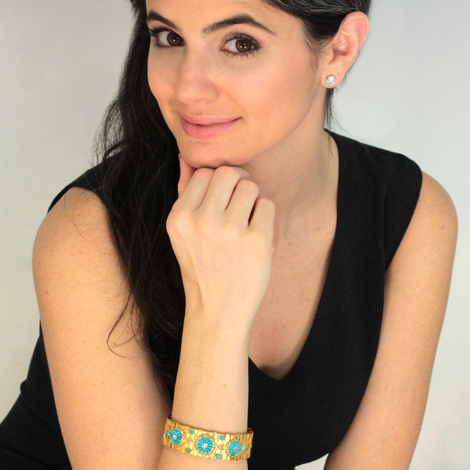 Circa 1870-1880s, 15k. This eye-catching Victorian bracelet is fashionably relevant and wearable history.  Vibrant Persian turquoise stones are meticulously arranged in floret motifs surrounded by and adorned at the center with diamonds.  Links