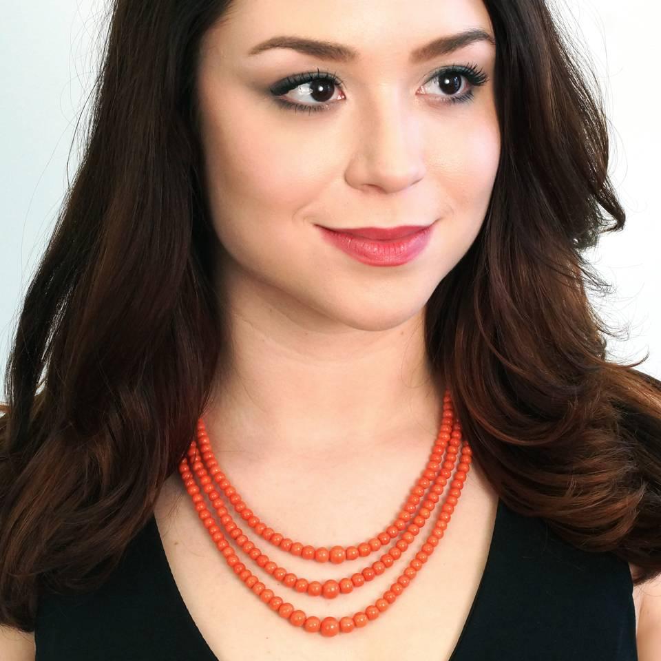 Circa 1890, 14k. This lush antique three-strand natural coral necklace adds the perfect pop of color to any fashionable moment. Vibrantly stylish, its versatile look trends from vintage-bohemian-chic to elegantly smart. The coral is a lovely deep