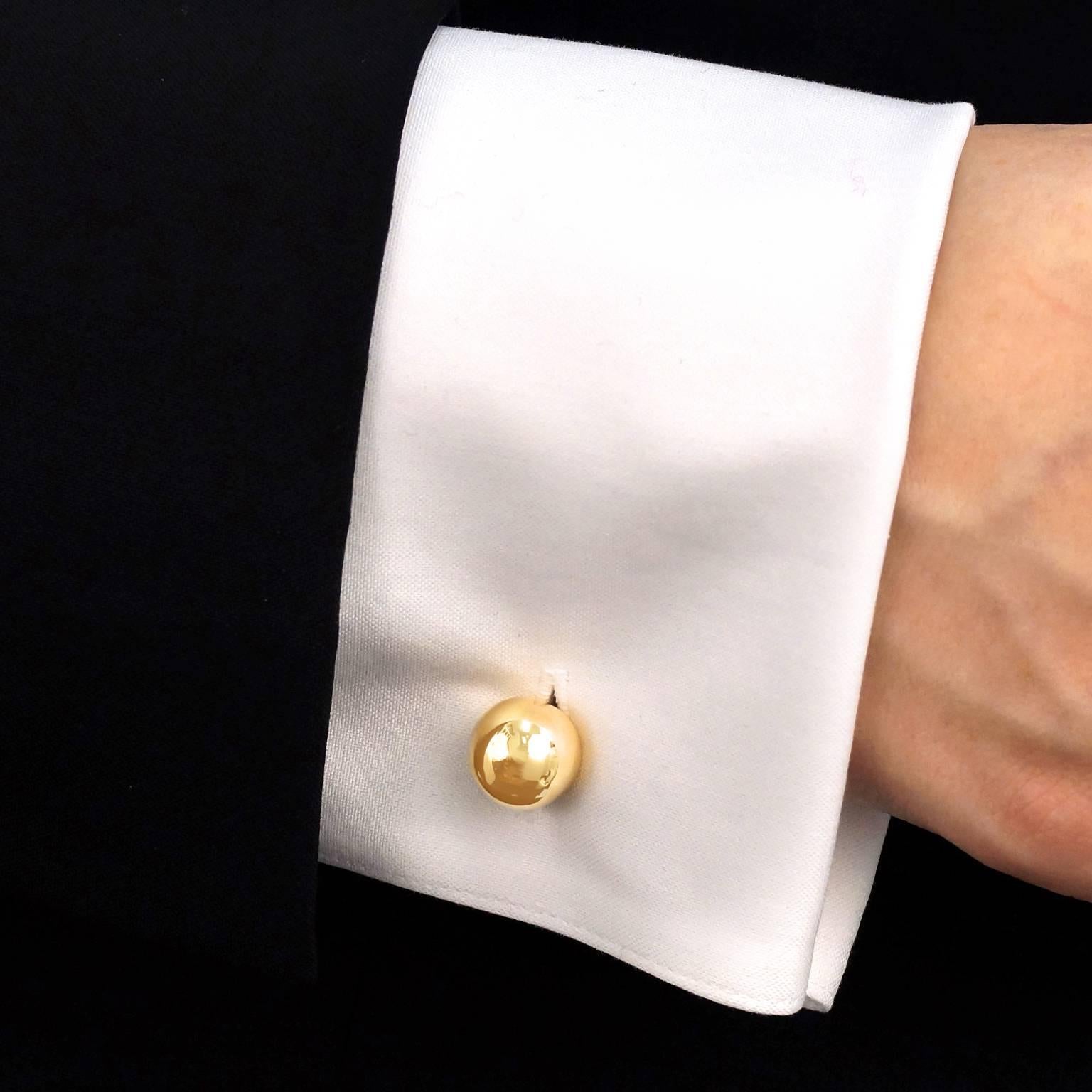 Circa 1950s, 14k, Cartier, New York. These impossibly stylish gold cufflinks from Cartier are the perfect finishing touch to an impeccable suit. Made in polished fourteen-karat gold to Cartier New York’s legendary standards, they have a lovely feel
