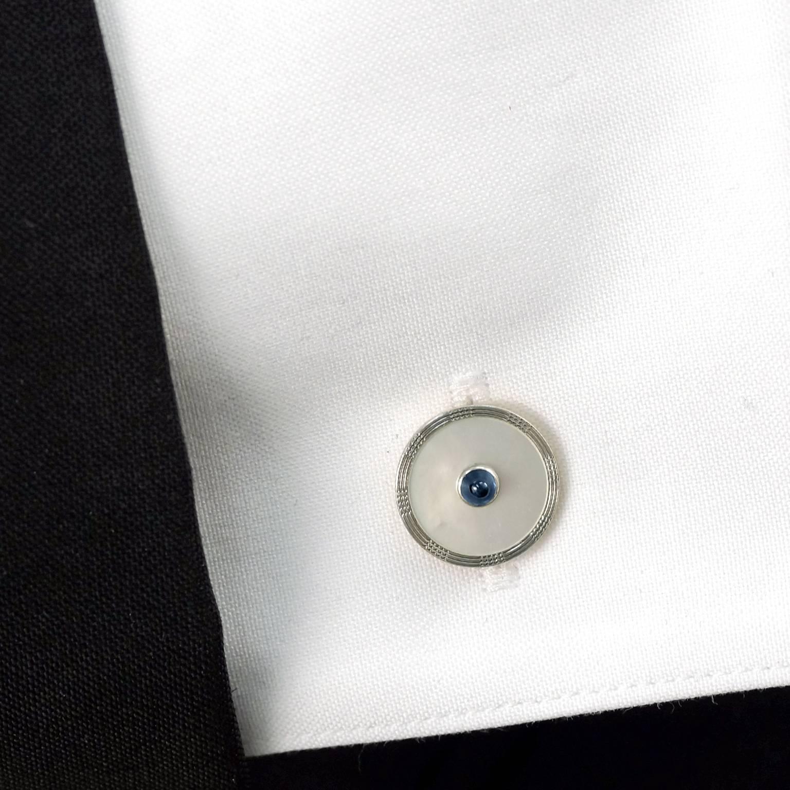 Circa 1950s, 14k, by Krementz, American.  This dapper fifties cufflink and stud set has a fresh, stylish look. The polished Mother of Pearl is enhanced by cabochon sapphires and framed with white gold. Beautifully made, they are in excellent