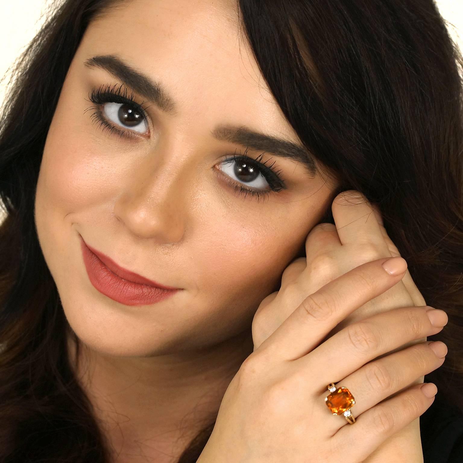 Circa 1950s, 14k, American.  The vibrant 6 carat citrine in this fabulous fifties ring is accented by two brilliant diamonds (I color, SI2 clarity) totaling .20 carats. Classic style and eye-catching color give it a look that is elegantly chic.