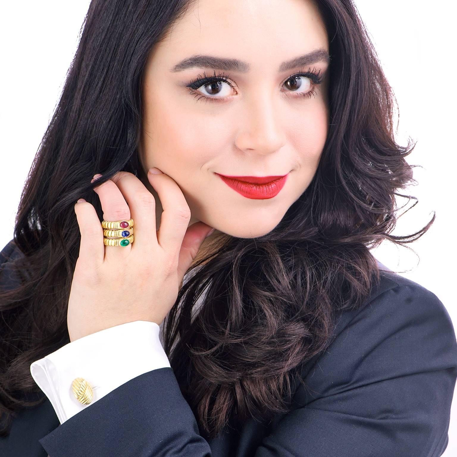 Circa 1980s, 18k, Bulgari, Italy.  For everyday ease and elegance, Bulgari signature pieces are unrivaled. These three rings, in Bulgari’s iconic tubogas motif, are each set with a vibrant cabochon stone – a .65 carat sapphire, a .65 carat ruby, and