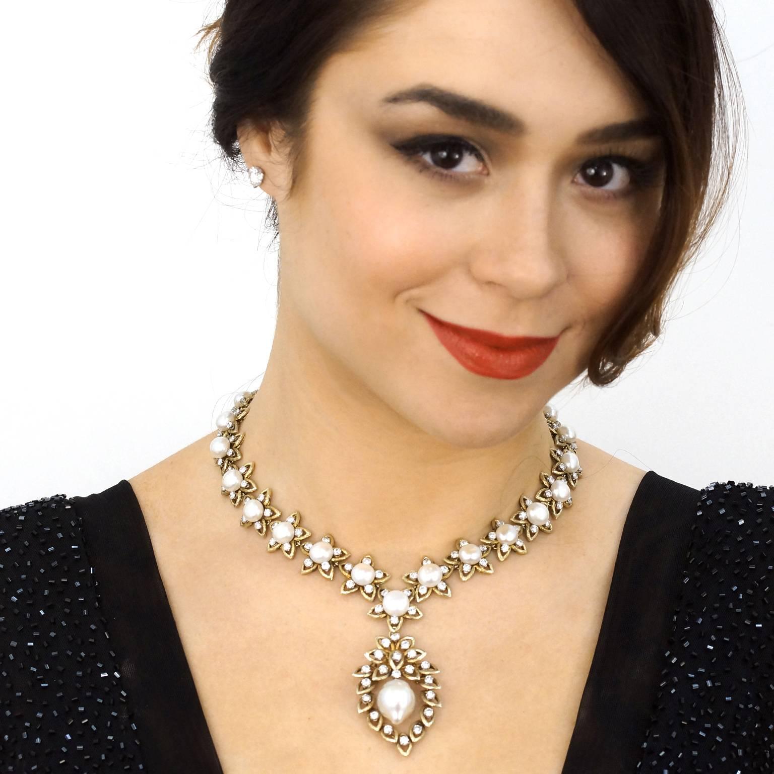 Circa 1960s, 14k, German. This glamorous necklace is set with 18 carats of brilliant white diamonds and a stunning collection of beautifully matched natural cultured pearls. A detachable drop, festooned with a huge pearl, gives the piece visual