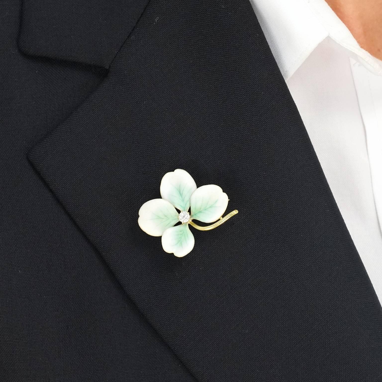 Circa 1910, 14k, American.  As classic as it is charming, this clover brooch is enameled in delicate pale green and ivory. Its fresh, gentle tones are perfectly offset by warm fourteen-karat gold and accented with a sparkly diamond. Beautifully made