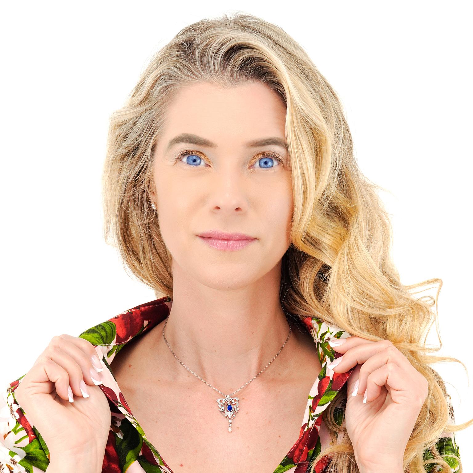 Circa 1910, Platinum, American. This gorgeous Edwardian lavaliere features a lively .50 carat cornflower blue sapphire and glittering white diamonds set in a delicately graceful shape. The look is romantically stylish. Meticulously hand made this