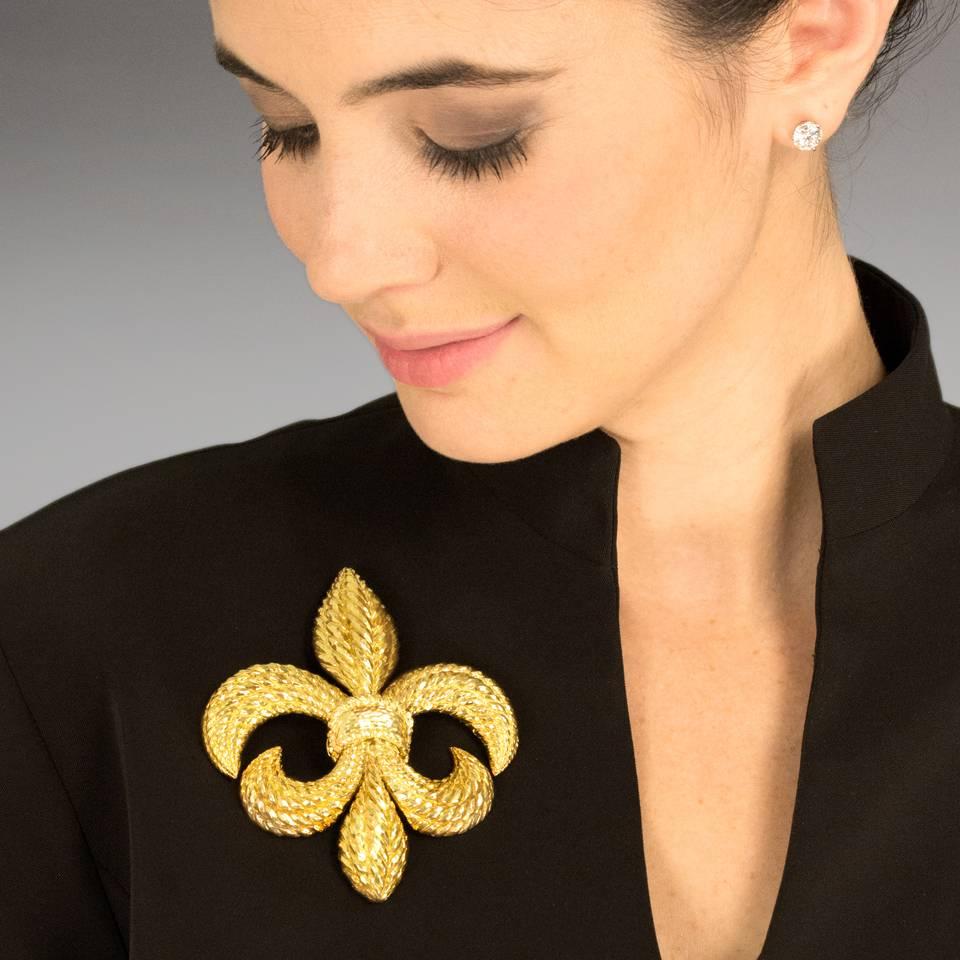 Circa 1950-60s, 18k and platinum, by David Webb, New York City.   Extremely dimensional and beautifully textured, this visually stunning fleur-de-lis brooch by David Webb is a rare massive example of this model. Finely fabricated in eighteen-karat
