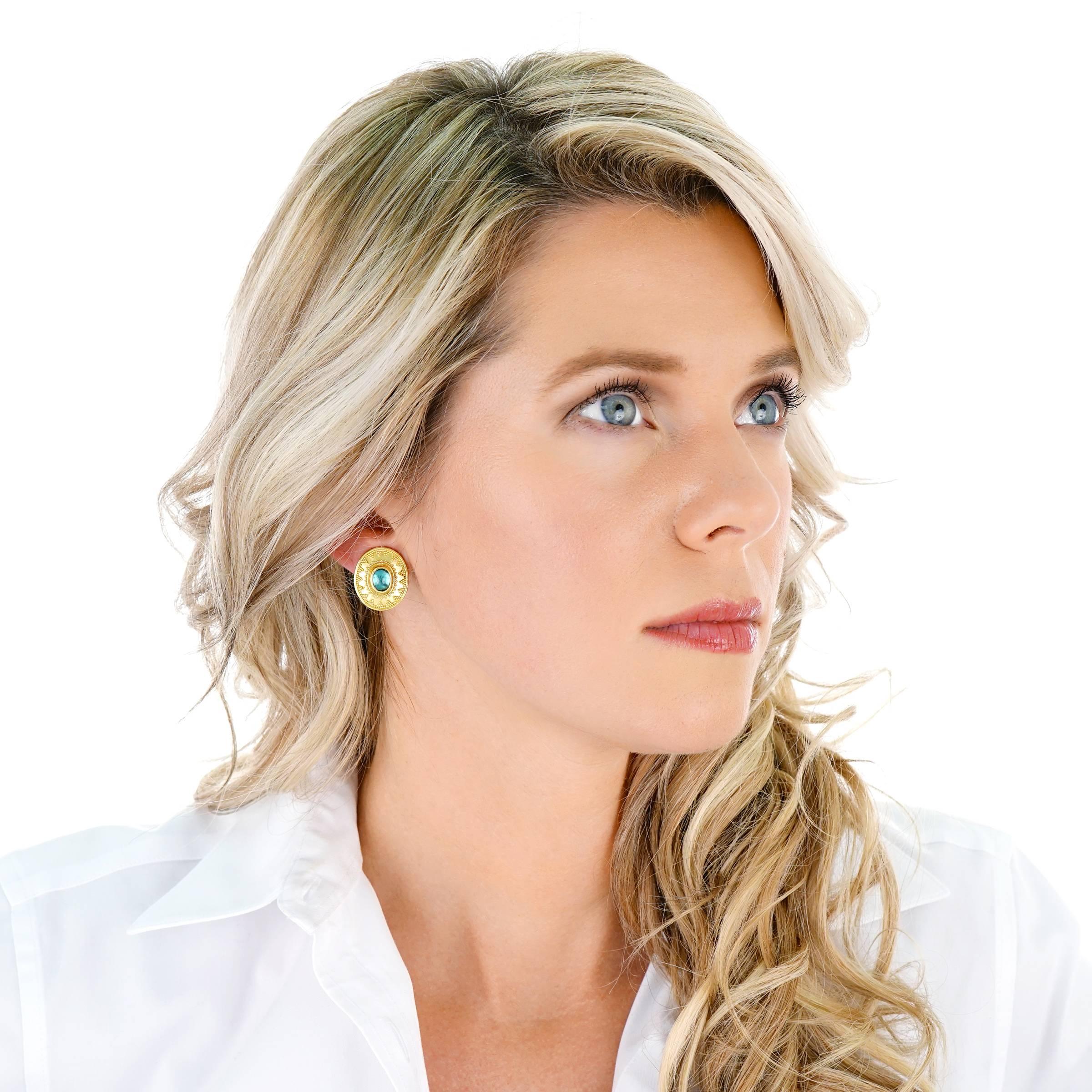 Circa 2000s, 22k/18k, Maija Neimanis, American. These chic Archaic motif earrings by Maija Neimanis are set with vibrant tourmaline cabochons surrounded by delicately intricate granulation. Schooled in ancient techniques, Neimanis transforms