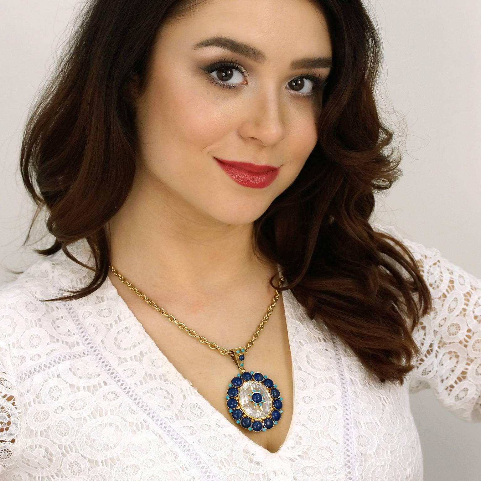 Circa 1890s, 14k. This antique pendant is authentic Bohemian at its vintage, Victorian best. It features a star-festooned rock crystal surrounded by the blue-on-blue of lapis and Persian turquoise. Uniquely set in bloomed yellow gold, its chic look