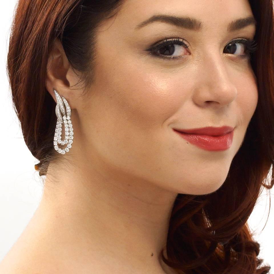 Circa 1970s, 18k, by Fred, Paris, France. Beyond Stunning, these diamond chandelier earrings from the esteemed firm Fred Paris are sublime creations of glittering white diamonds. At home on the red carpet or dazzling out on the town, they are