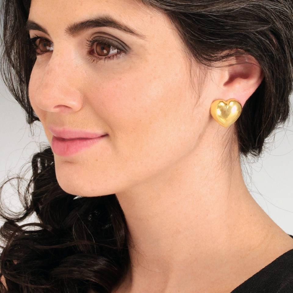 Circa 1970s, 18k, Swiss. Perfect and polished, these Mod Seventies eighteen-karat gold heart earrings have a playfully chic style that dresses up or down with ease. Meticulously fabricated in a Swiss Atelier, they are just the right size and