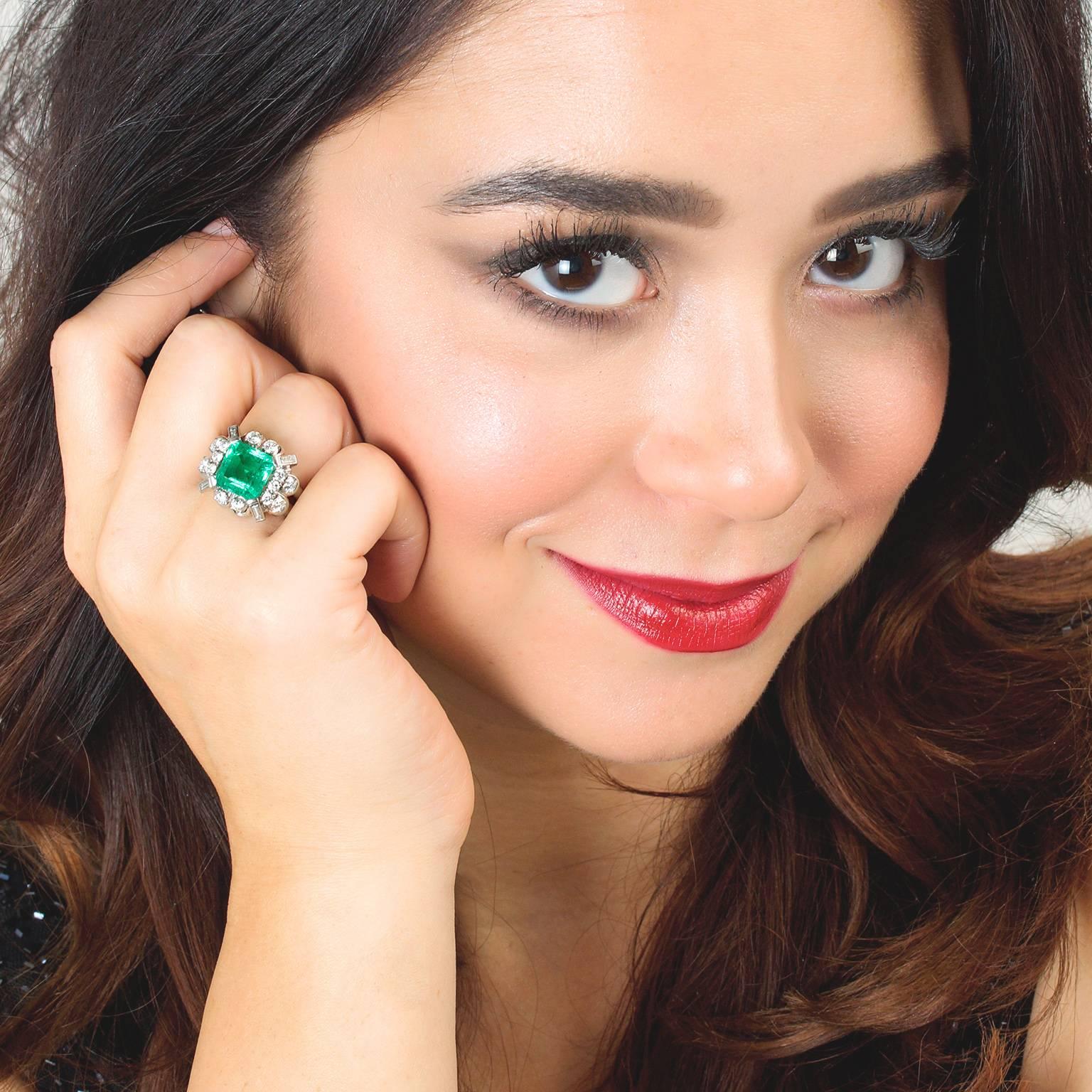 Circa 1960s, platinum, American.   I love a ring that is all about color. This gorgeous sixties ring features a fine 4.0 carat Columbian emerald (GIA report) surrounded by .74 carats of brilliant white diamonds in platinum. It is the perfect