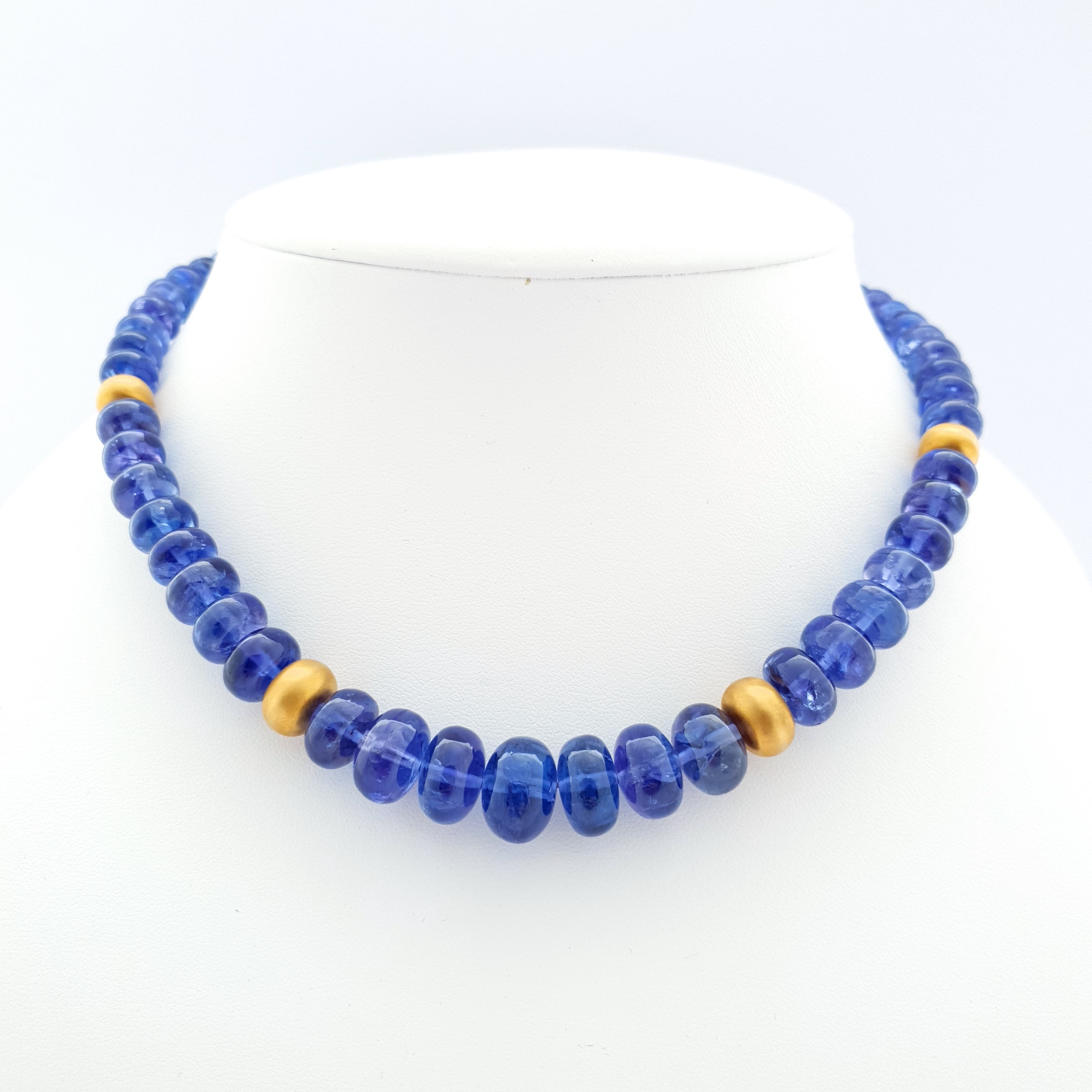 This Cornflower blue Tanzanite Rondel Beaded Necklace with 18 Carat Mat Yellow Gold is totally handmade. Cutting as well as goldwork are made in German quality. The screw clasp is easy to handle and very secure.
Timeless and classic design combined
