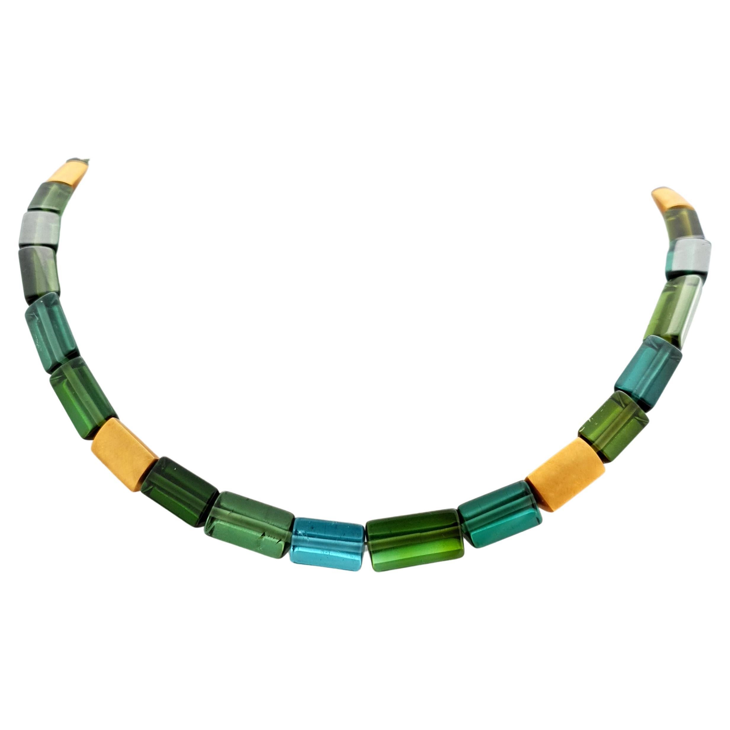 This Blue green Tourmaline Crystal Beaded Necklace with 18 Carat mat yellow Gold is totally handmade. Cutting as well as goldwork are made in German quality. The screw clasp is easy to handle and very secure. Triangular goldbeads match perfectly to