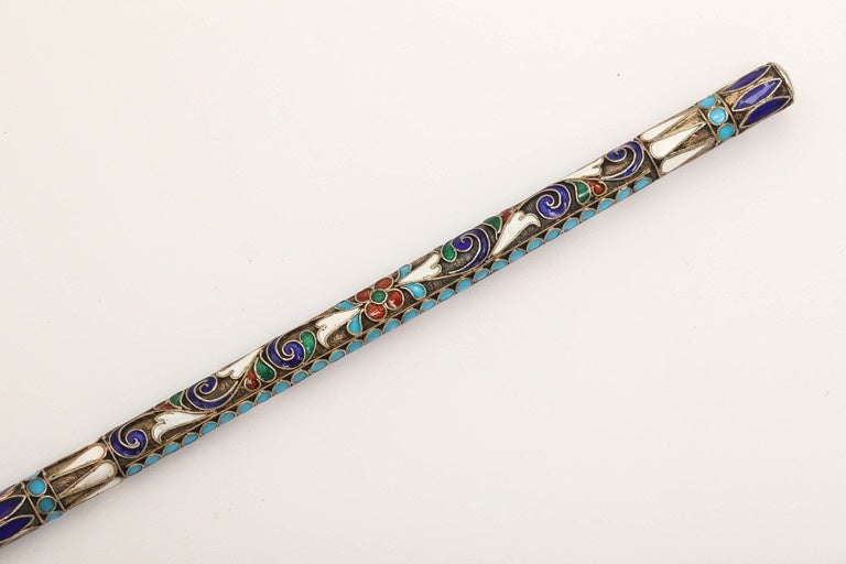 A rare Russian enameled silver-gilt dip pen from the Romanov era, period of Tsar Nicholas II, of gilded silver with cloisonné enameled scrolling foliage within turquoise enameled beads, fitted with a period gold nib.

Moscow, 1908-17, hallmarked.

6