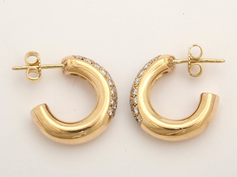 Beautiful Parisian 18k gold and diamond hoops, the fronts pavé set with diamonds, mounted on gold posts.

France, 20th century, hallmarked with eagle head.

3 /4 in. (1.9 cm.), the hoop measures .38 inches.