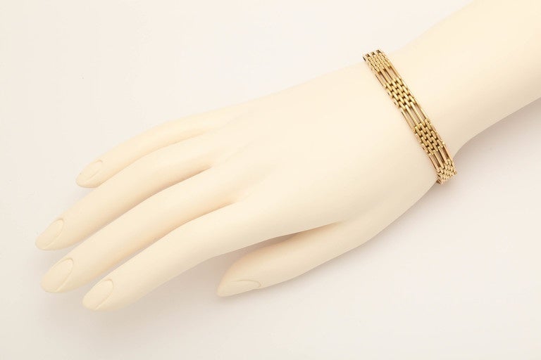 A rare imperial-era gold bracelet, circa 1900 designed as sections of gate links alternating with smaller oval links some of which are textured.

Kiev, circa 1900, hallmarked. 

-7 in. (17.8 cm.) long