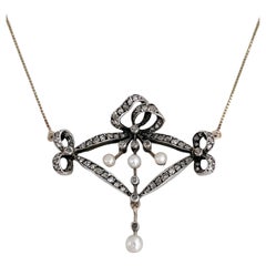 Edwardian 14 Karat Gold Pearl Rose Cut Diamond Bow Pendant Necklace