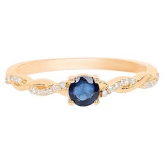 Bague en saphir bleu sertie de diamants (0,32 carat), en or jaune 10 carats