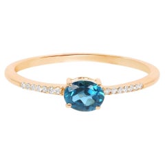 Bague en or jaune 10 carats avec topaze bleue de Londres et diamants (0,4 carat)