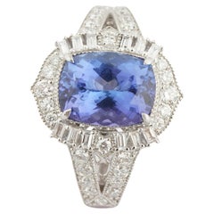 Natural tanzanite diamond rings in 18k gold