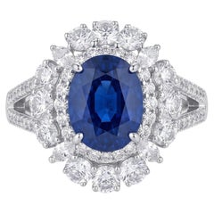 Natural Royal Blue Sapphire and Diamond Cluster Ring in 18k Gold