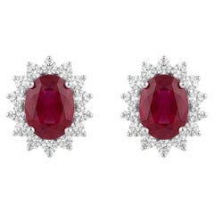 Boucles d’oreilles clous en or naturel 18 carats, ornées d’un diamant de 0,59 carat et d’un rubis