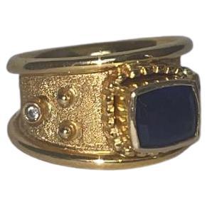 For Sale:  Egyptian Elixir Ring in 18k Gold with Blue Sapphire and Two Diamonds 2
