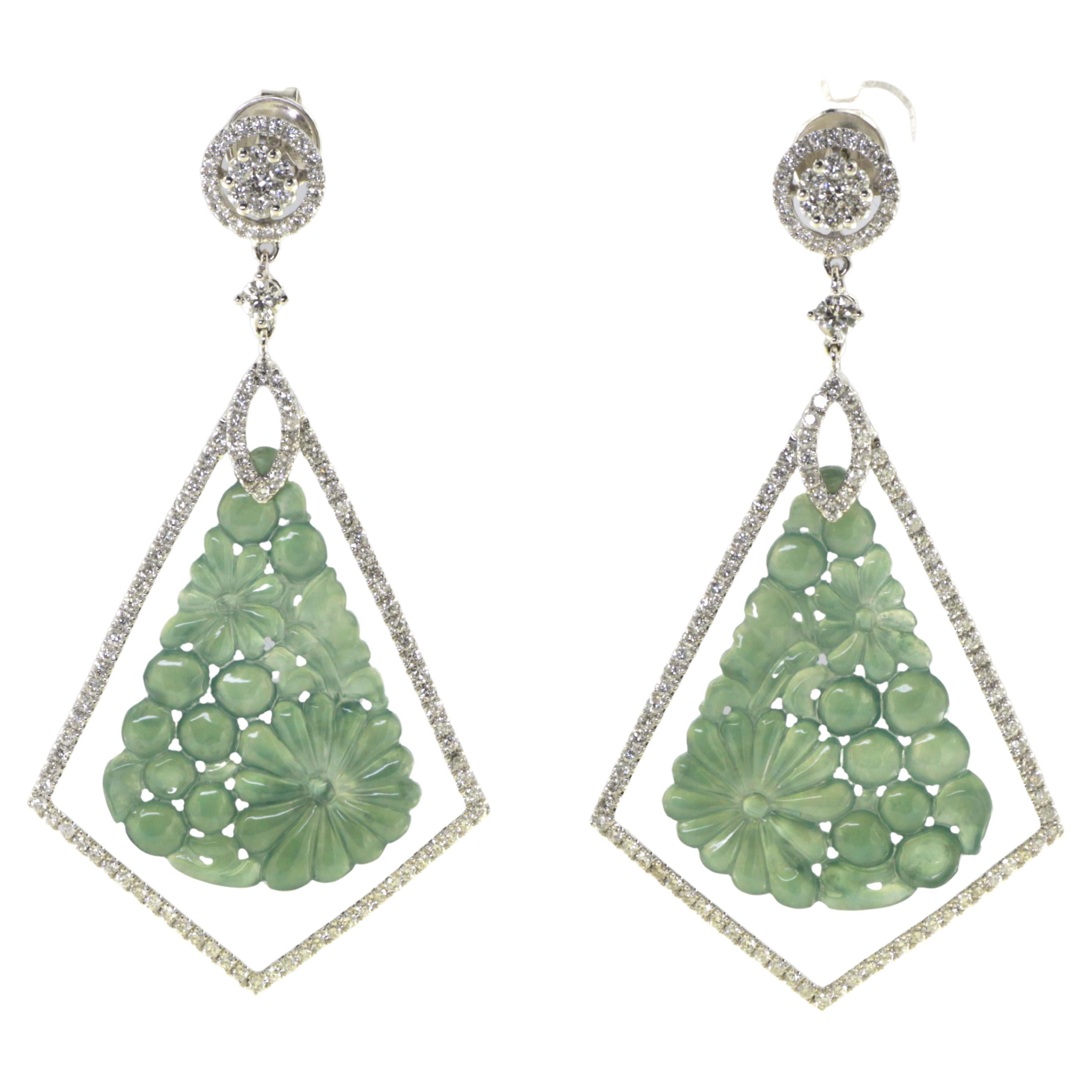 Introducing our exquisite Vintage Jadeite Diamond Drop Earrings, a stunning pair that showcases the beauty of jadeite and the brilliance of diamonds. Crafted in 18 karat white gold, these earrings exude timeless elegance and sophistication.

At the