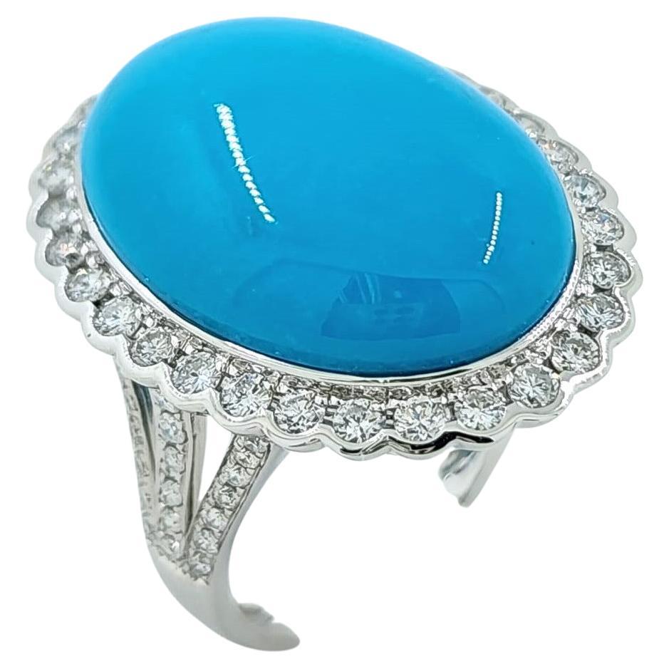 Introducing our breathtaking Vintage 11.64 Carat Sleeping Beauty Turquoise Diamond Ring in 14K White Gold. This exquisite piece combines the allure of Sleeping Beauty Turquoise with the timeless elegance of diamonds. The center stage is taken by a