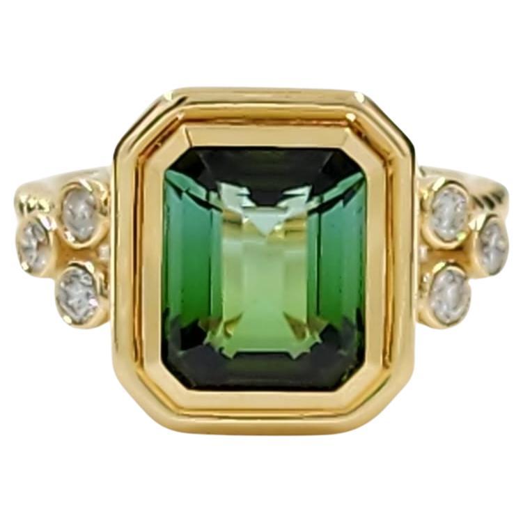 This is an exquisite Tourmaline Cocktail Ring crafted in 18-karat yellow gold, showcasing a splendid example of fine jewelry design. The ring features a magnificent 3.72-carat tourmaline as its centerpiece. This tourmaline is cut into a classic