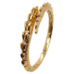 Bracciale rigido "Croc Tail Cuff" in oro giallo massiccio 18 carati di Ohliguer, Australia