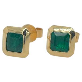Pair of emerald earrings/ studs 18k gold studs bezel set For Sale