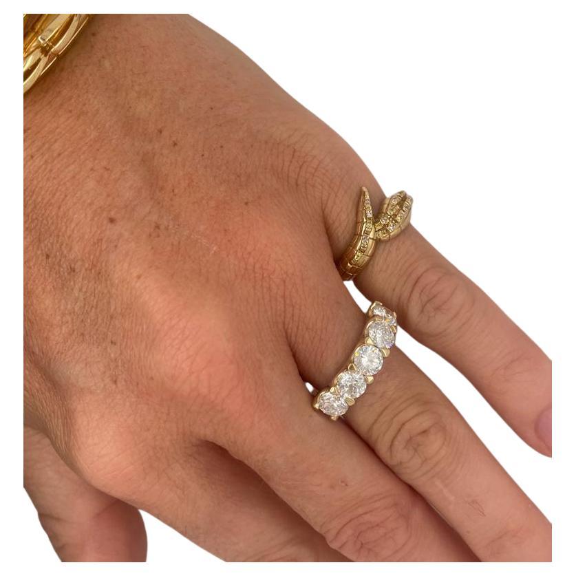 

18ct yellow gold diamond band featuring  5 x 0.50ct GSI white round brilliant cut natural diamonds

5 = 2.50ct of diamonds

Sharp eagle claws

Scolloped side profile

Tapered band

18ct yellow gold

Eternity Diamond Band

Size 6.5 USA 
