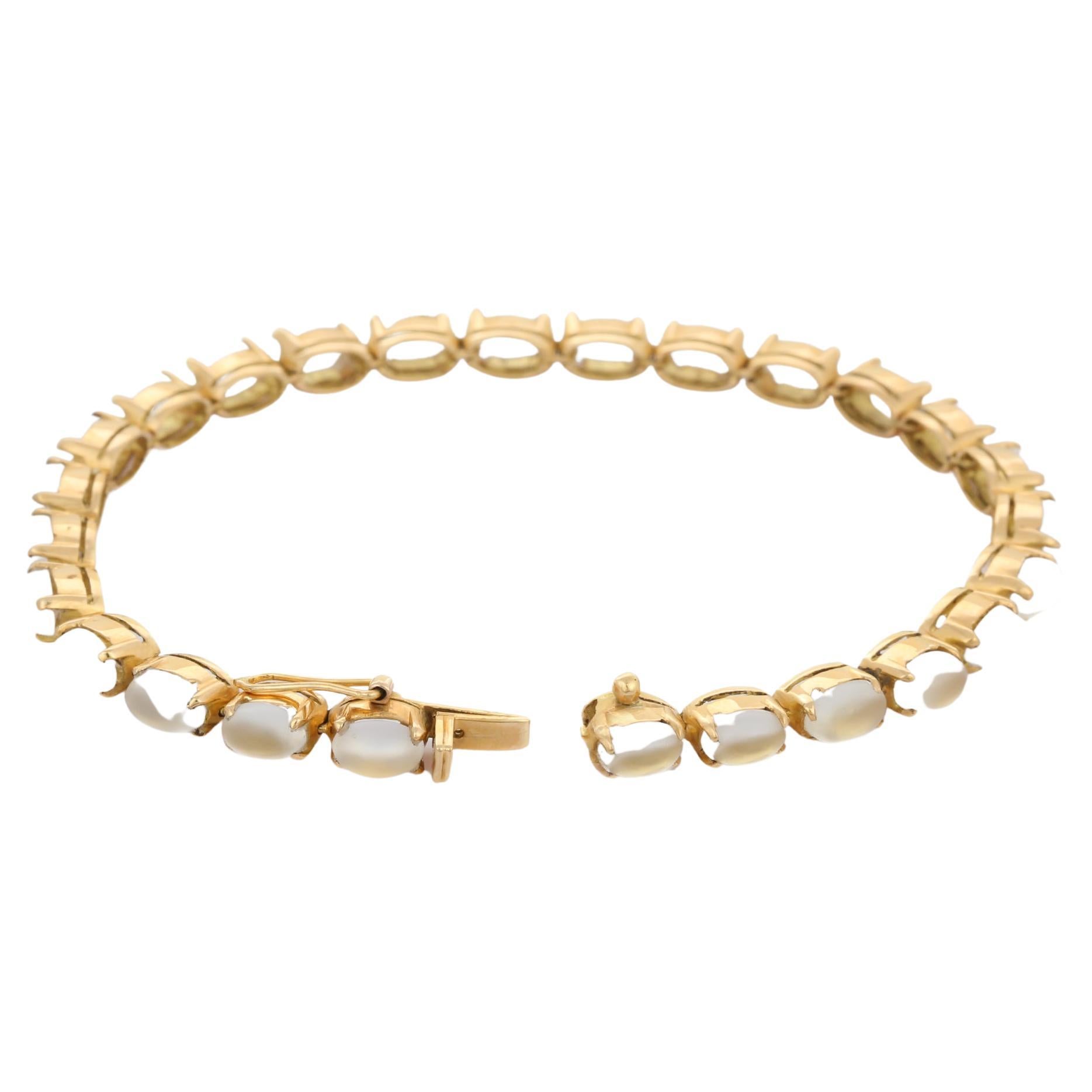 This Rainbow Moonstone Tennis Bracelet in 18K gold showcases 26 endlessly sparkling natural rainbow moonstone, weighing 15 carats. It measures 7.25 inches long in length. 
Rainbow moonstone brings balance, harmony and hope.
Designed with perfect