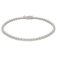 Bracelet tennis en or blanc 18 carats avec grappes de diamants