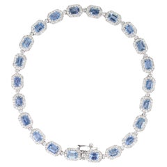 Modernes Tennisarmband aus 14-karätigem Weißgold mit 5,55 Karat blauem Saphir und 1,54 Karat Diamanten im Halo-Setting
