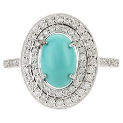 Anello da cocktail con turchese naturale a cabochon da 1,51 ct e halo di diamanti, in oro bianco 14K