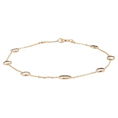 Bracelet minimaliste en or jaune massif 14 carats, avec une chaîne à maillons irréguliers sertis de diamants en lunette
