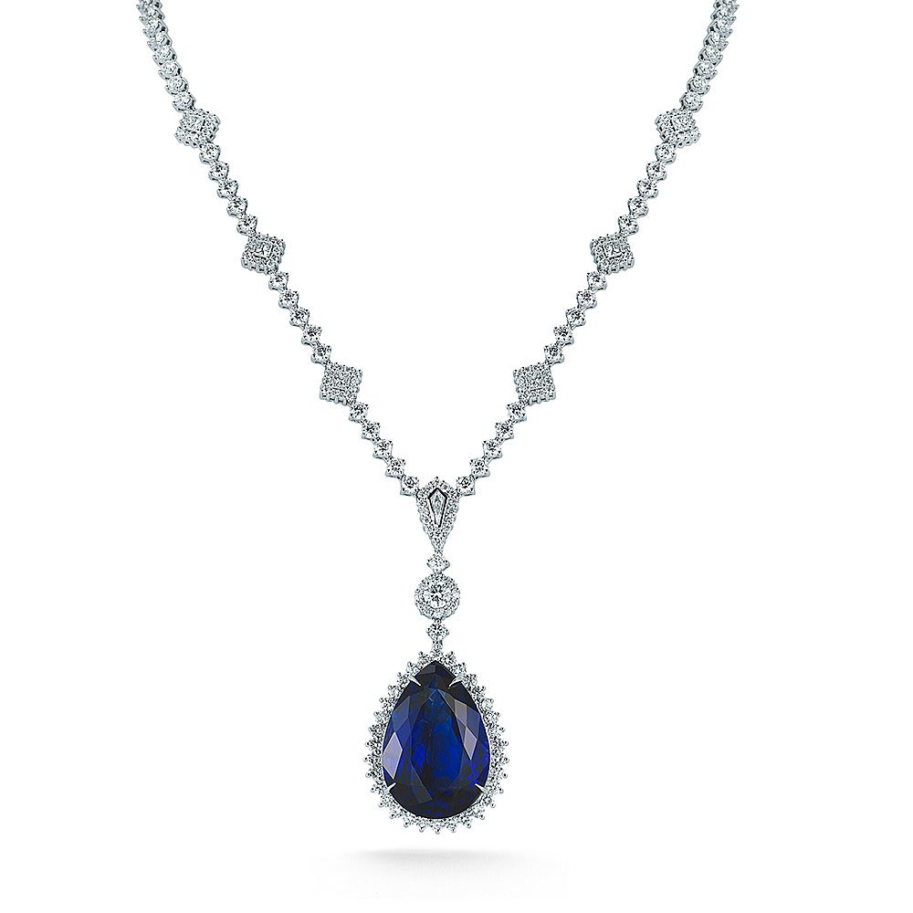 Amazing Royal Blue Color Tanzanite Pear Shape mounted In Pendant with Diamond. Tanzanite is Certified By GIA

SPECIFICATIONS	    
Product ID:01799
Model: TK MB 250
Metal: 18K W
Country Of Origin:USA

DIAMOND
•  Round: 14.30Ct.
•  Squaire &