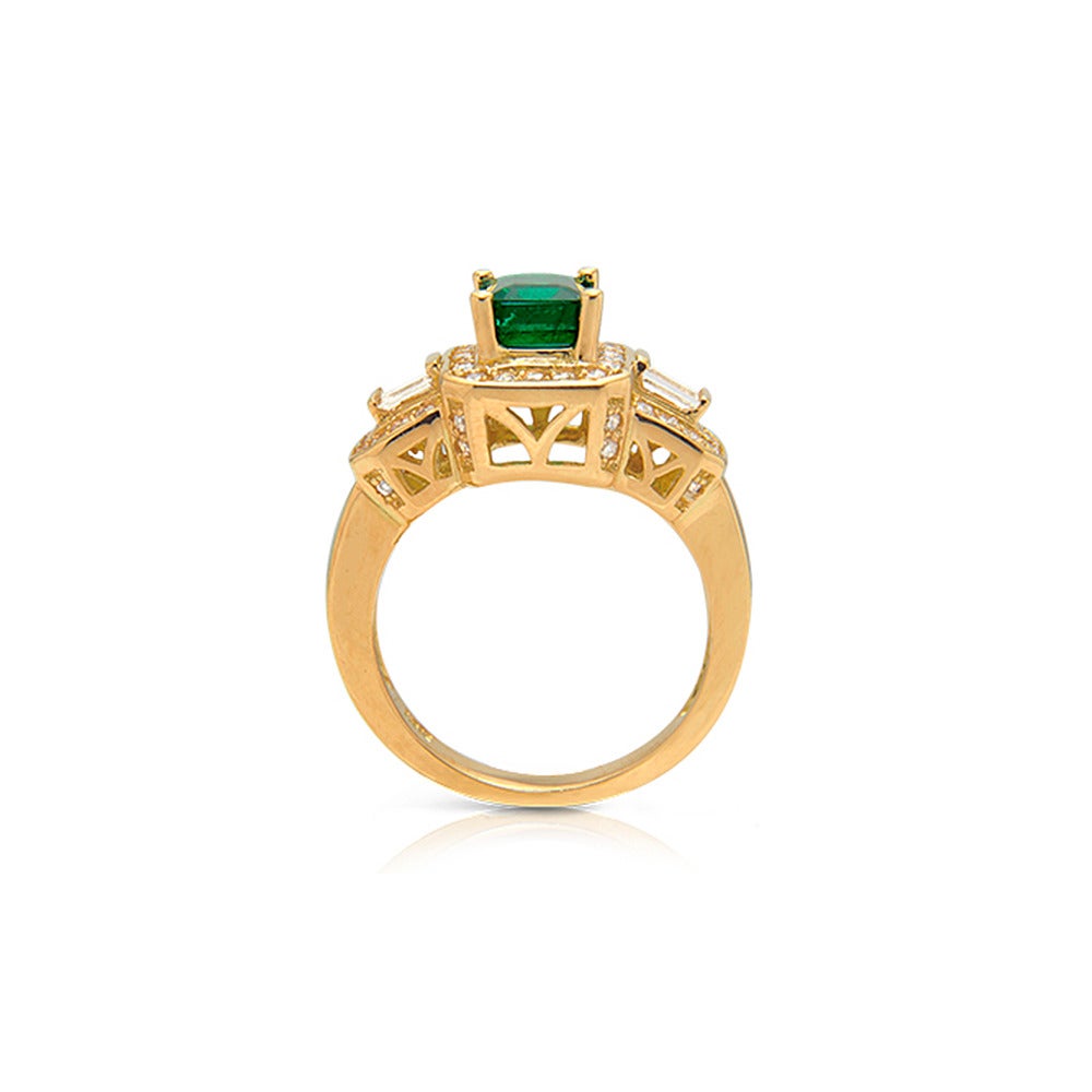 Product ID:00846
Model:TK 155
Metal:18K Yellow Gold
Gram Weight:8.21
Stock:1
Ring Size:6.75
Country Of Origin:USA

DIAMOND:
•  Round: 0.69Ct.
•  Baguette:0.24Ct.
•  Total Diamond Wt.: 0.93Ct.

GEMSTONE:
Emerald : 1.43