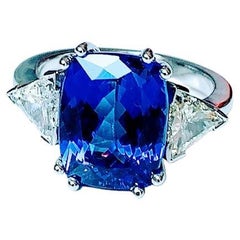 Tanzanite Cushion 6, 37 Carat and Pair Trillant Diamond Ring White Gold 18 Carat