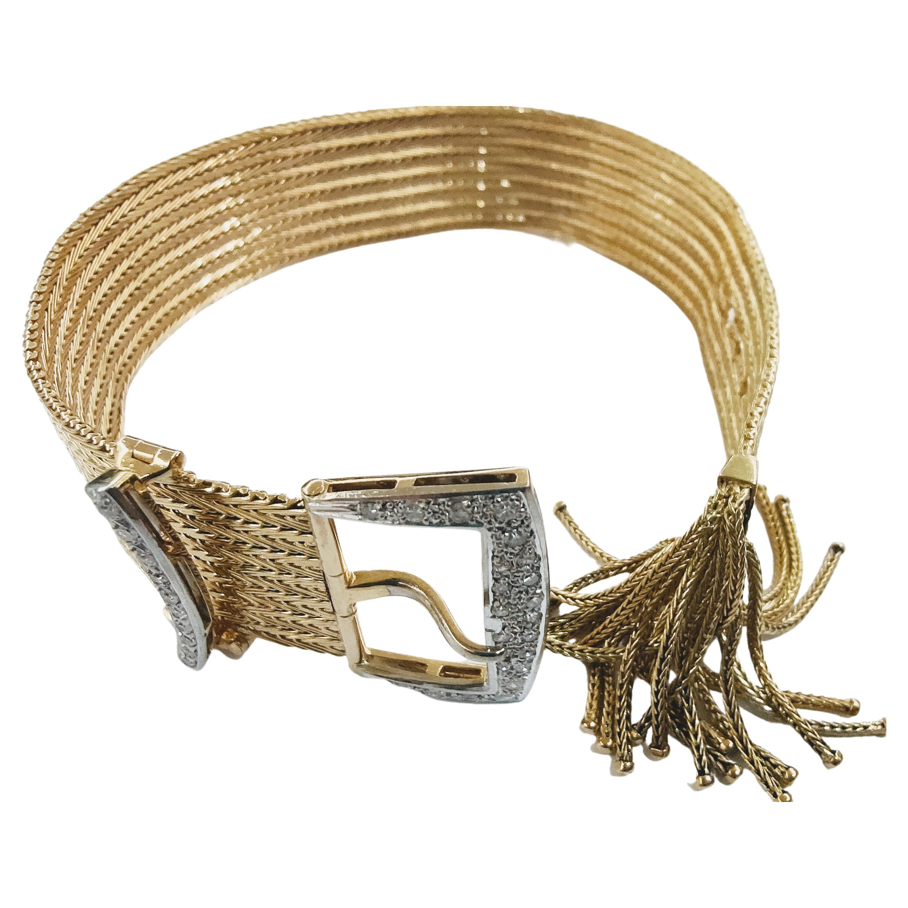Wonderful and important Belt bracelet with Buckle and pin decorated with diamonds simple cut topped with fringes at the end made of yellow gold 18 kts and Platinum with a weight of 64.70 grams. As for the length, its flexibility and preparation