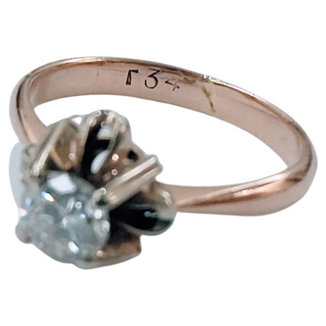 

Solitaire Ring Combined with Chaton in White gold setting in claws and body in rose gold 18 karat weight 3.32 grams. Diamonds in Brilliant cut measure 4.9 x4.9 x3 millimeters. Weight =0.46 carats Clarity VVS1 Color F-G. 
Ring size 13.5
