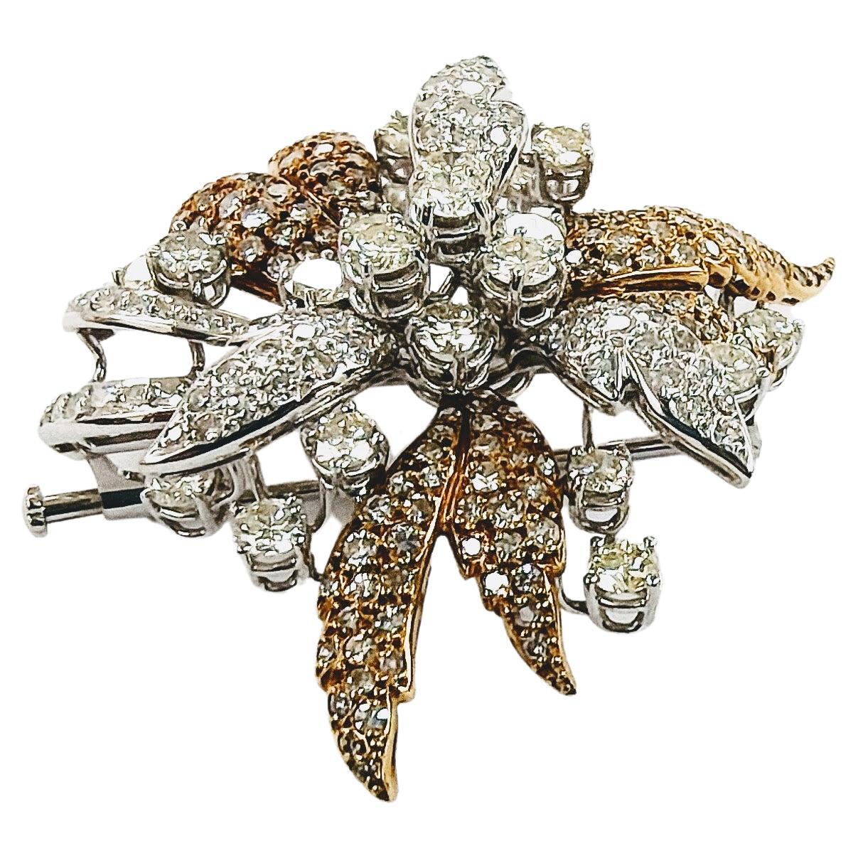 Wonderful brooch in the form of Flower with central Rosette prong setting in yellow and white gold 18 Karat weight 19.44 grams and double needle curdled with Diamonds in brilliant cut setting pave total weight 6 carats.
Rosette and sides: 23